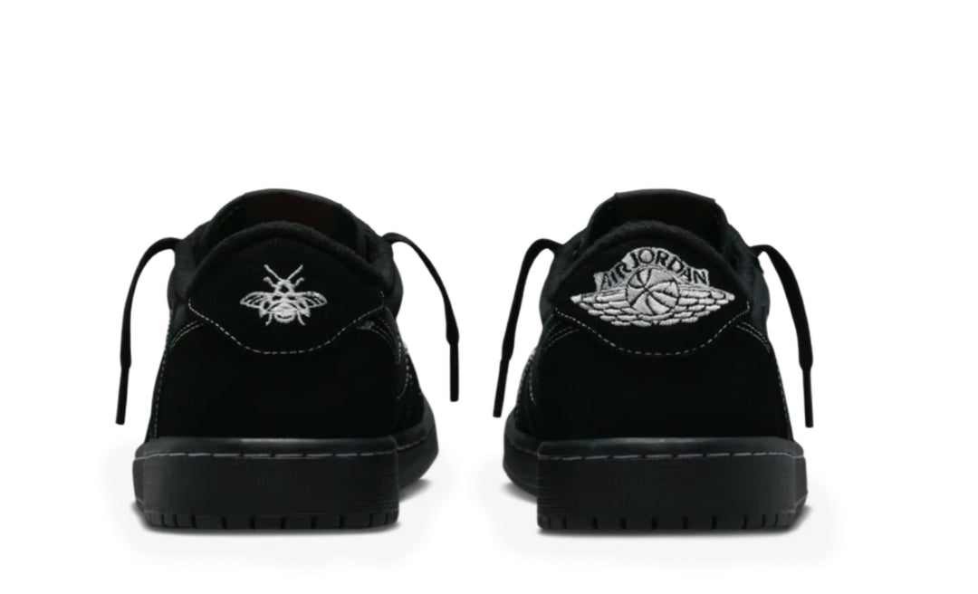 Jordan 1 Low Travis Scott Phantom en color negro con Swoosh invertido y costuras blancas
