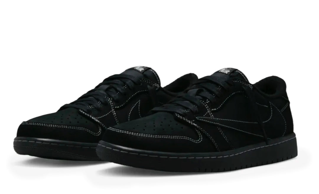 Jordan 1 Low Travis Scott Phantom en color negro con Swoosh invertido y costuras blancas