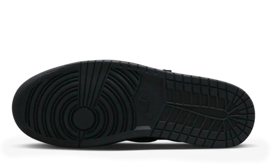 Jordan 1 Low Travis Scott Phantom en color negro con Swoosh invertido y costuras blancas